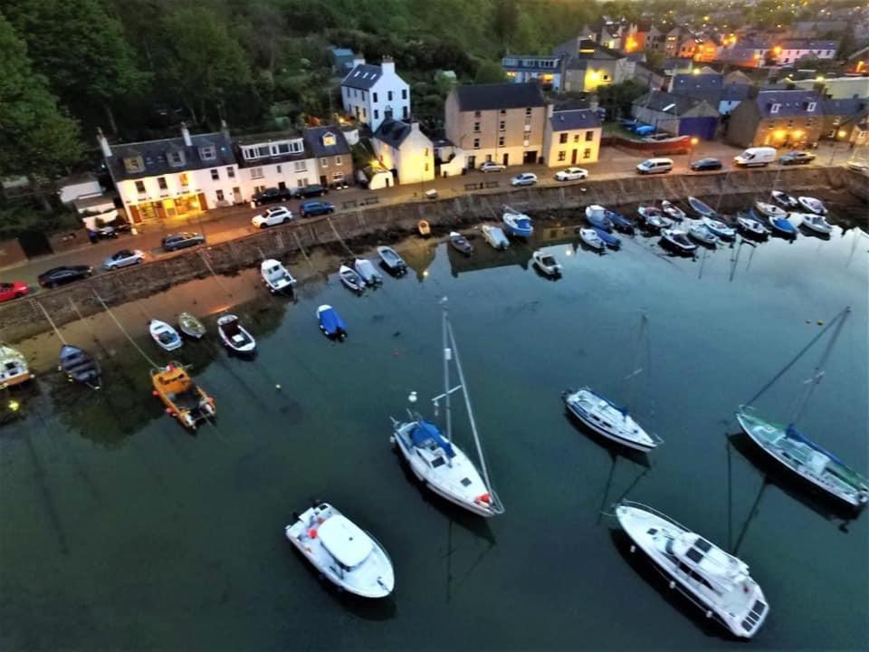 a group of boats in the water in a harbor at Lily Bank Room in Stonehaven