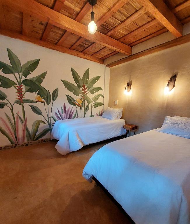 Postel nebo postele na pokoji v ubytování Aracari Ecolodge