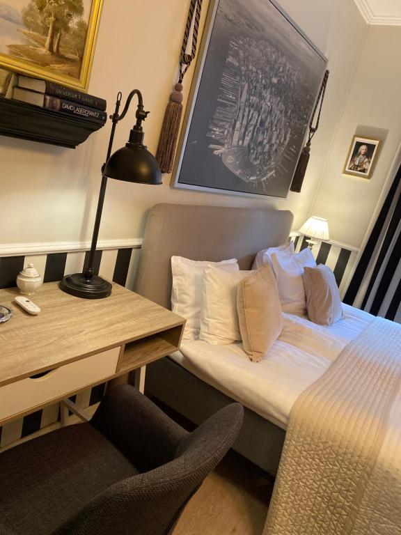 Postel nebo postele na pokoji v ubytování Strand Hotel