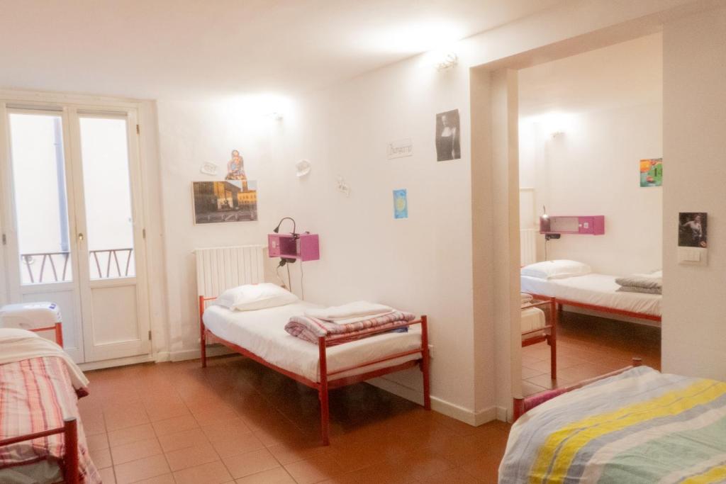 Postel nebo postele na pokoji v ubytování Hostel Il Nosadillo - Bologna