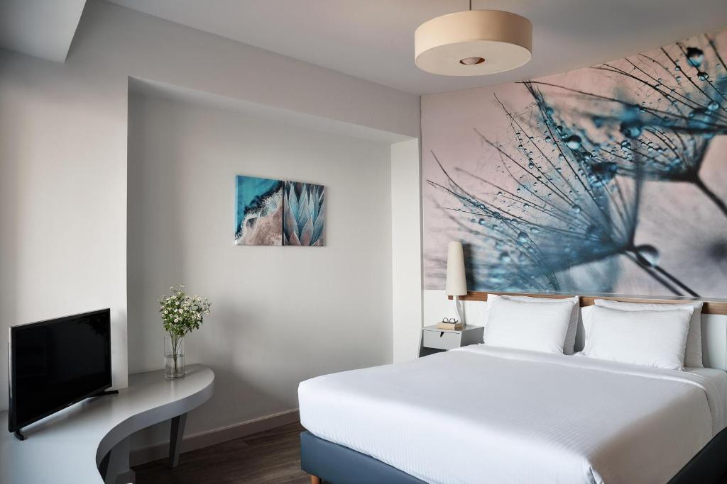 Postel nebo postele na pokoji v ubytování Lato Boutique Hotel