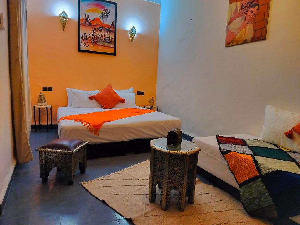 Postel nebo postele na pokoji v ubytování RIAD MAMAHOUSE