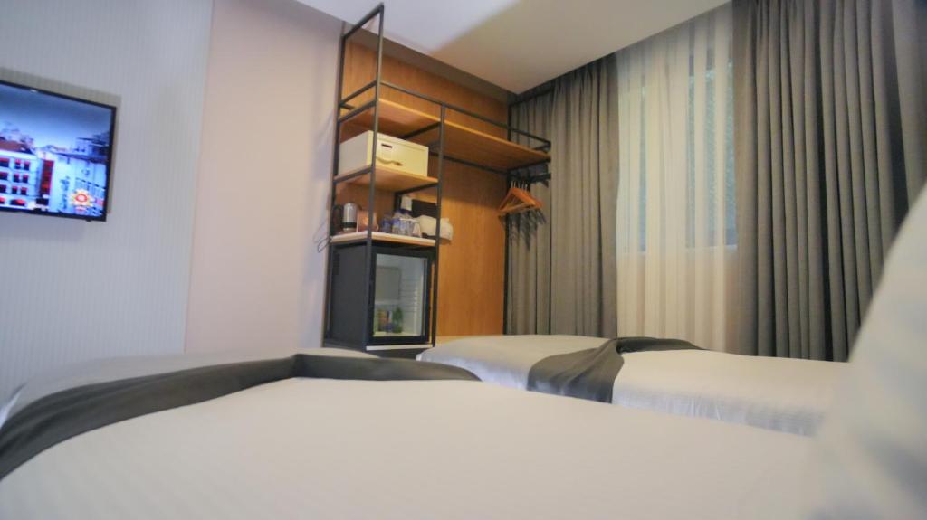 Postel nebo postele na pokoji v ubytování Dosso Dossi Hotels Old City