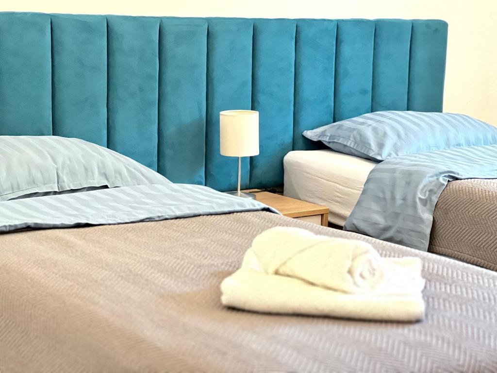 Postel nebo postele na pokoji v ubytování All Seasons Apartments Laško