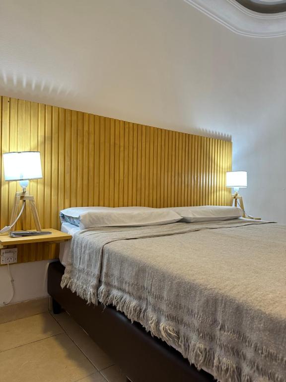 A bed or beds in a room at Petit Balcarce Salta