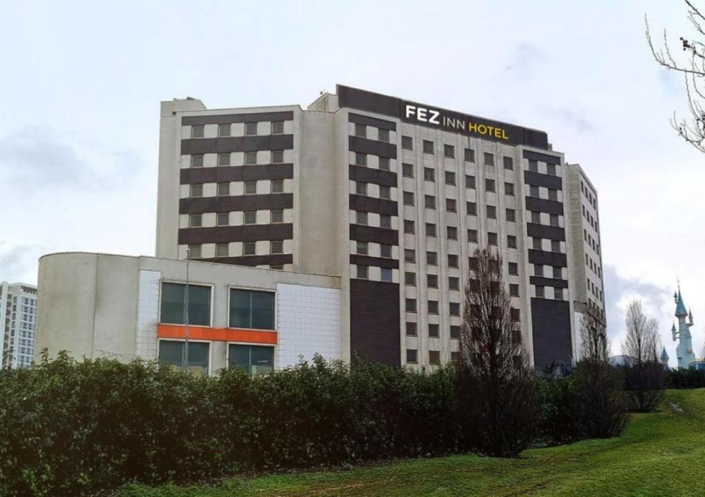 a building with a sign on the top of it at FEZ INN Hotel in Istanbul