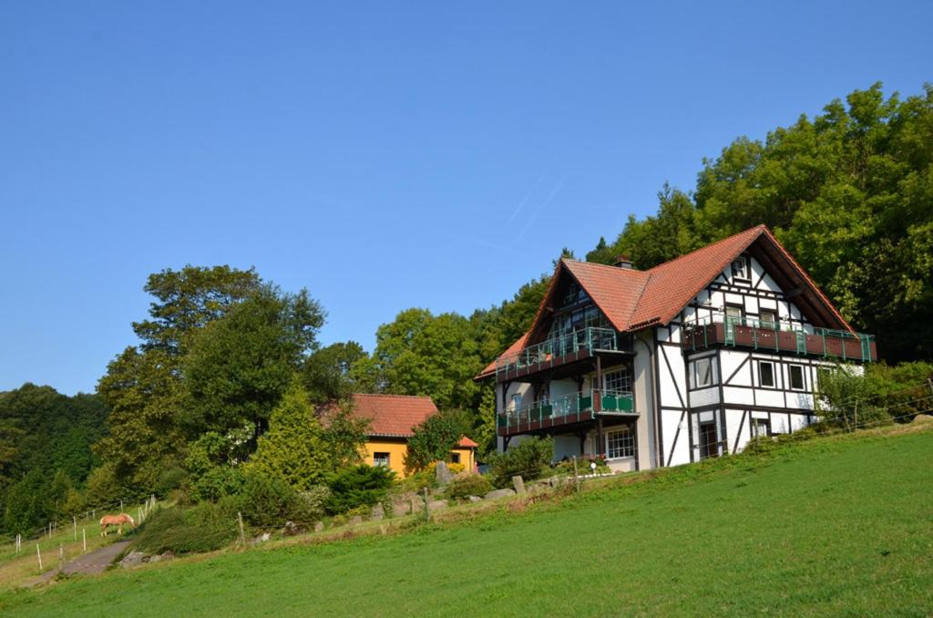 a large house on top of a hill at Ferienhaus Abtsroda in Abtsroda