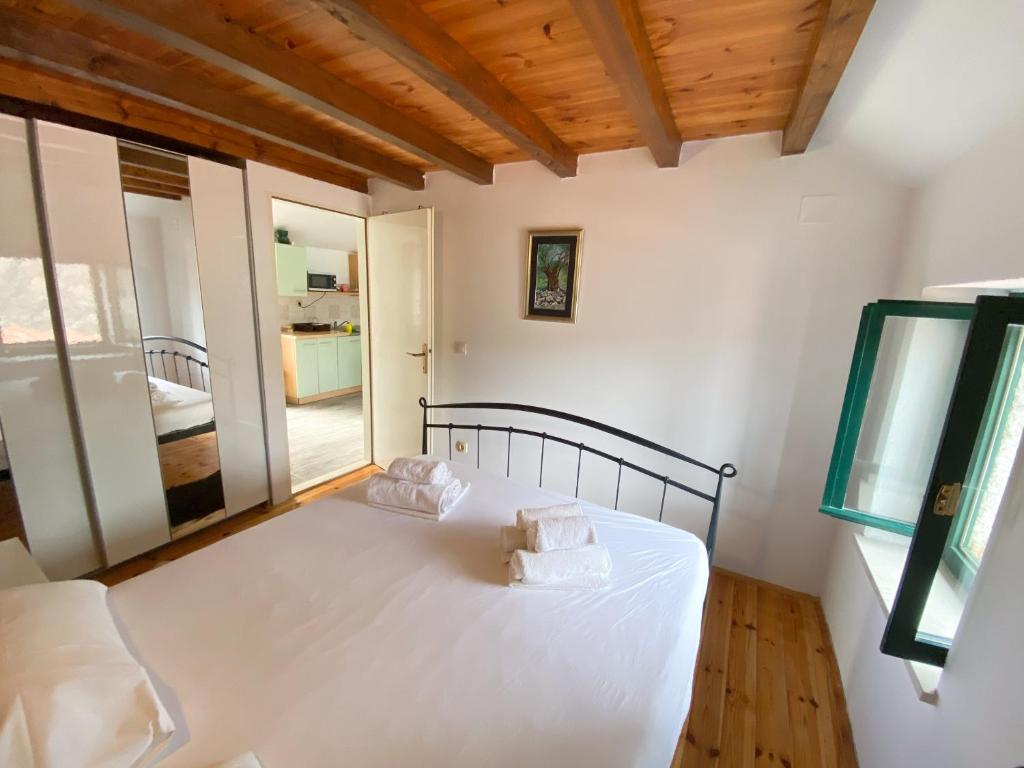 Posteľ alebo postele v izbe v ubytovaní Apartman Robi