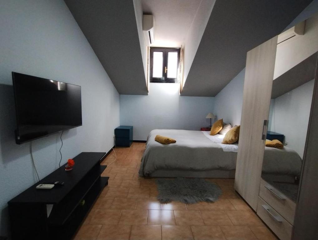 A bed or beds in a room at Aparment Puerta de sol