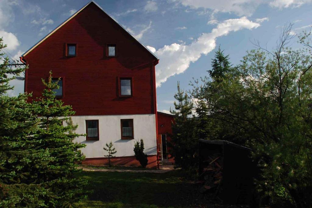 a red and white house with a red roof at Holiday home in Haj pod Klinovcem 1681 in Háj