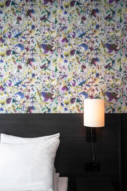 Postel nebo postele na pokoji v ubytování Thon Hotel Tromsø