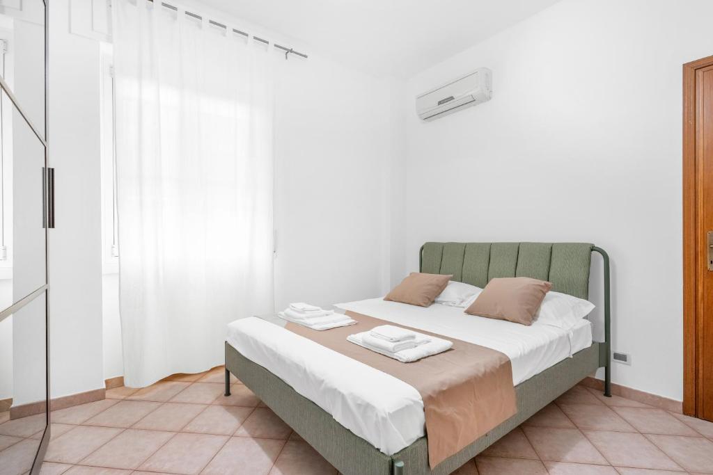 En eller flere senge i et værelse på Casa da Suite Cavour