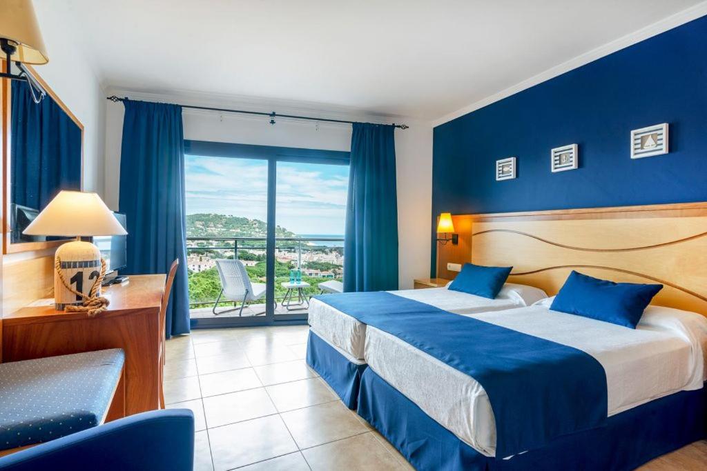 Postel nebo postele na pokoji v ubytování Hotel Garbi