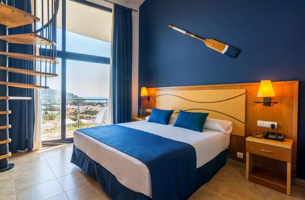 Postel nebo postele na pokoji v ubytování Hotel Garbi