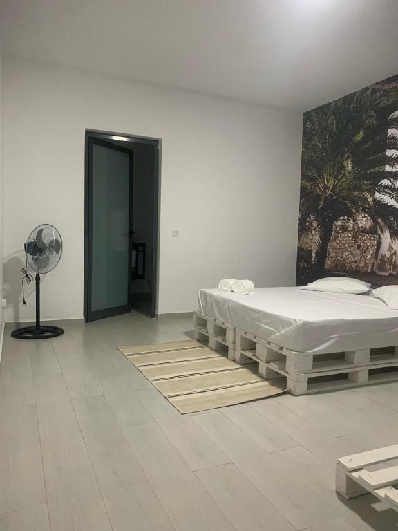 Postel nebo postele na pokoji v ubytování Palmira House