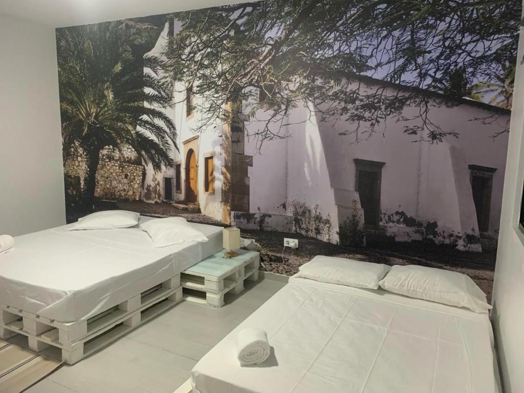 Postel nebo postele na pokoji v ubytování Palmira House
