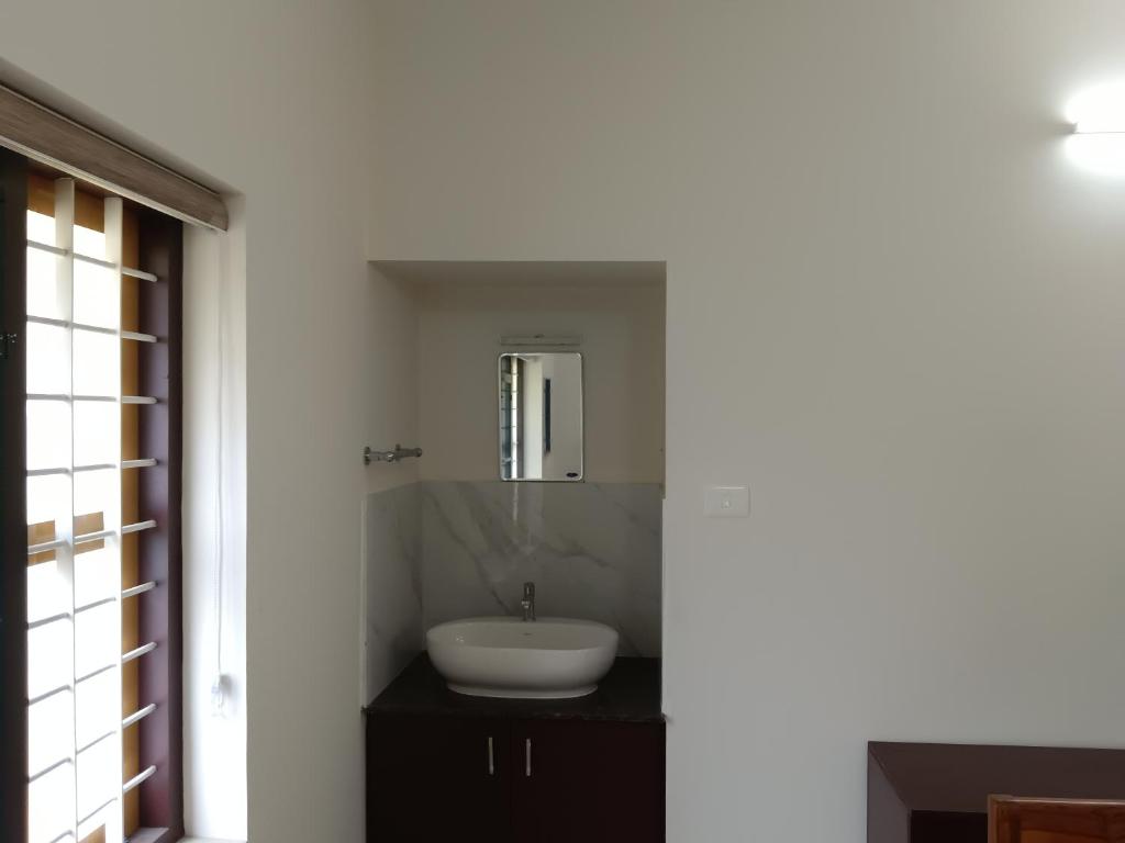 Koupelna v ubytování Greenview Royal Stay Near Amrita Hospital Edappally