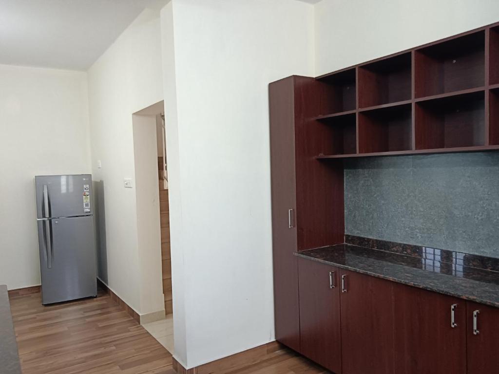 Kuchyň nebo kuchyňský kout v ubytování Greenview Royal Stay Near Amrita Hospital Edappally