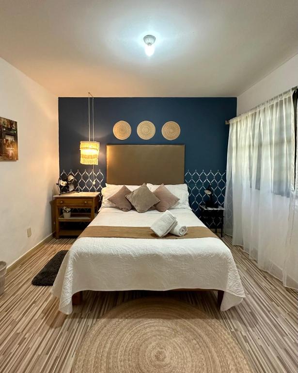 Postel nebo postele na pokoji v ubytování Casa Miranda Morelos