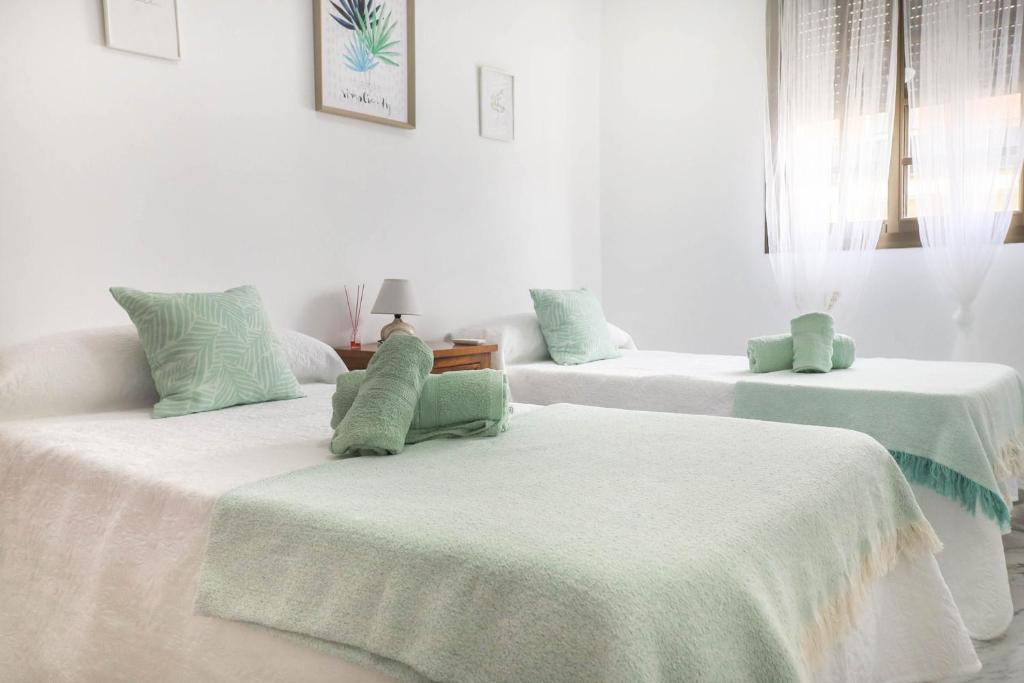Кровать или кровати в номере Royal Rent Sanlúcar Soberao
