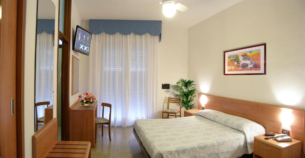 Postel nebo postele na pokoji v ubytování Hotel Bellaria