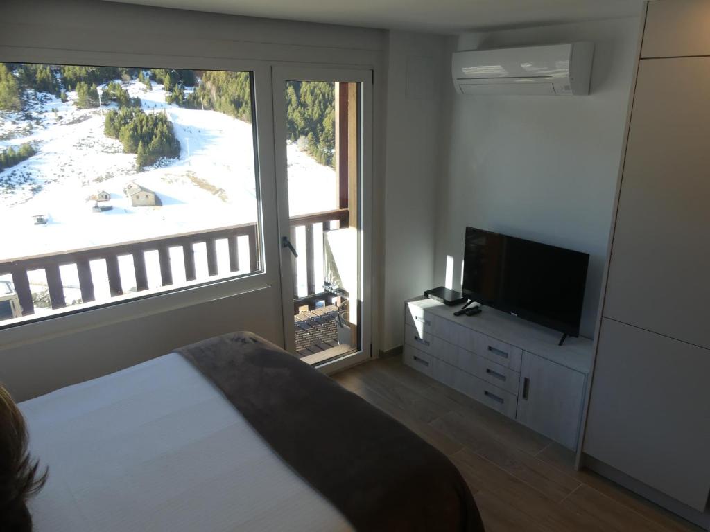 TV a/nebo společenská místnost v ubytování Ideal per una escapada