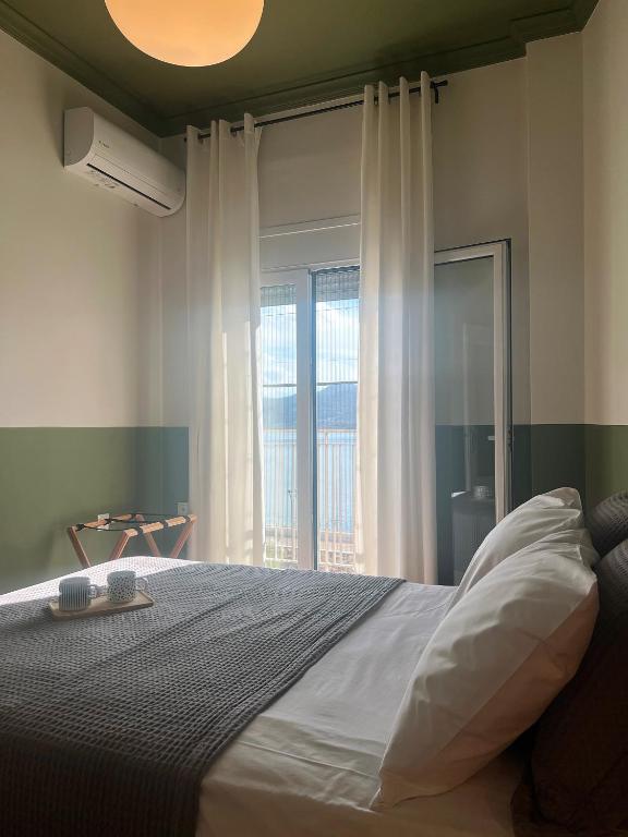 Postel nebo postele na pokoji v ubytování ALPHA HOME SITIA 2