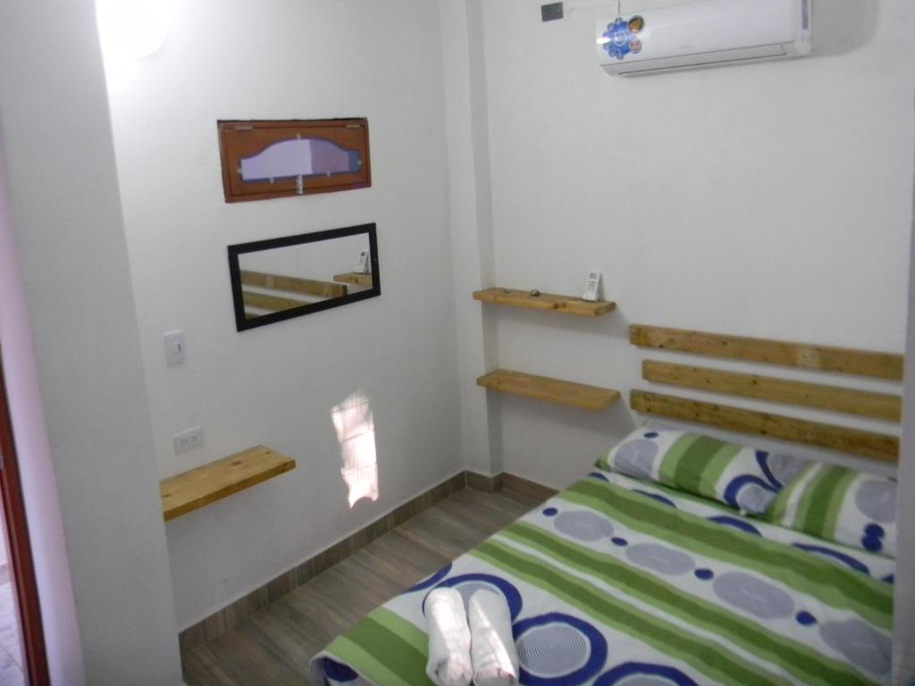 Postel nebo postele na pokoji v ubytování HostalNativo