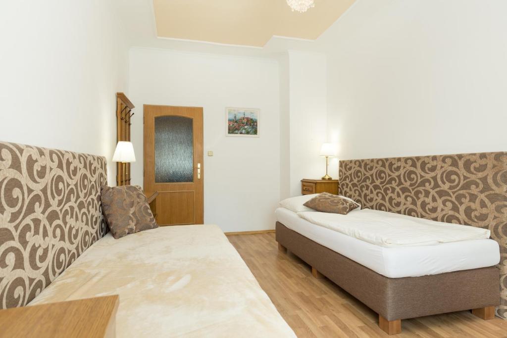 Postel nebo postele na pokoji v ubytování Hotel Praga