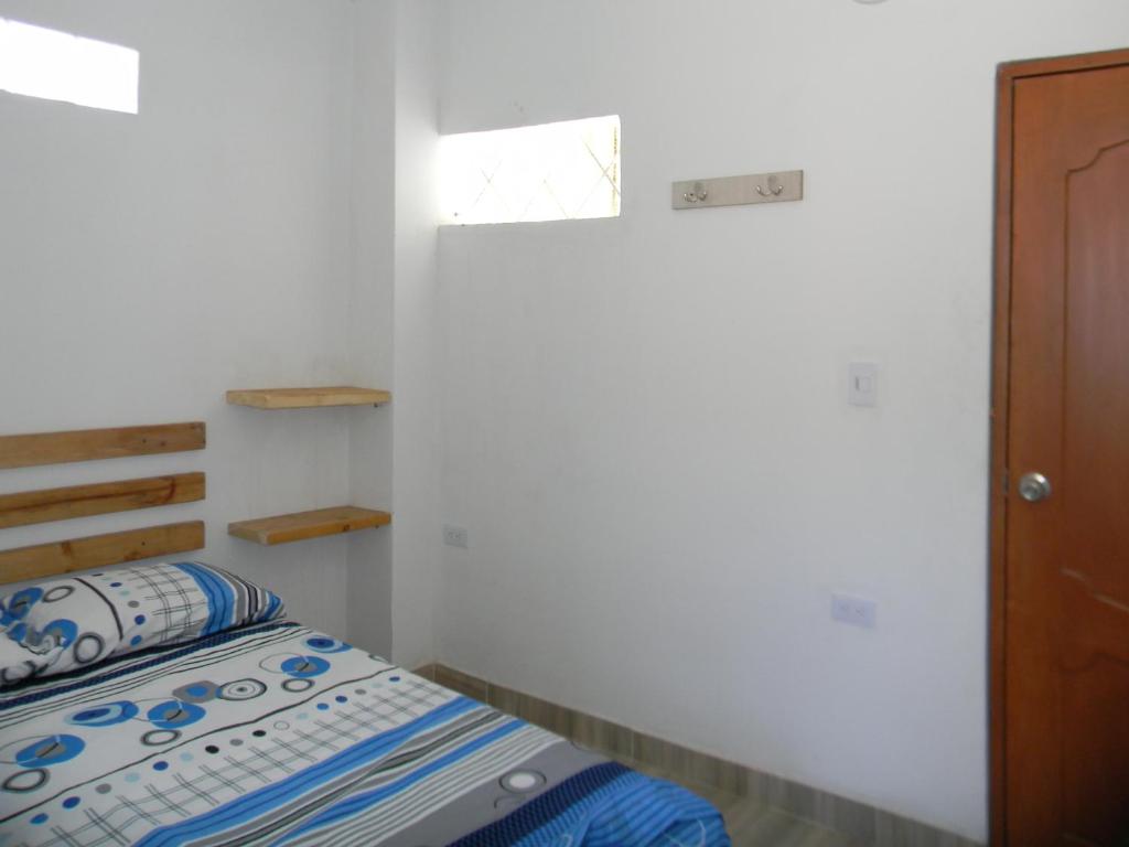 Postel nebo postele na pokoji v ubytování HostalNativo