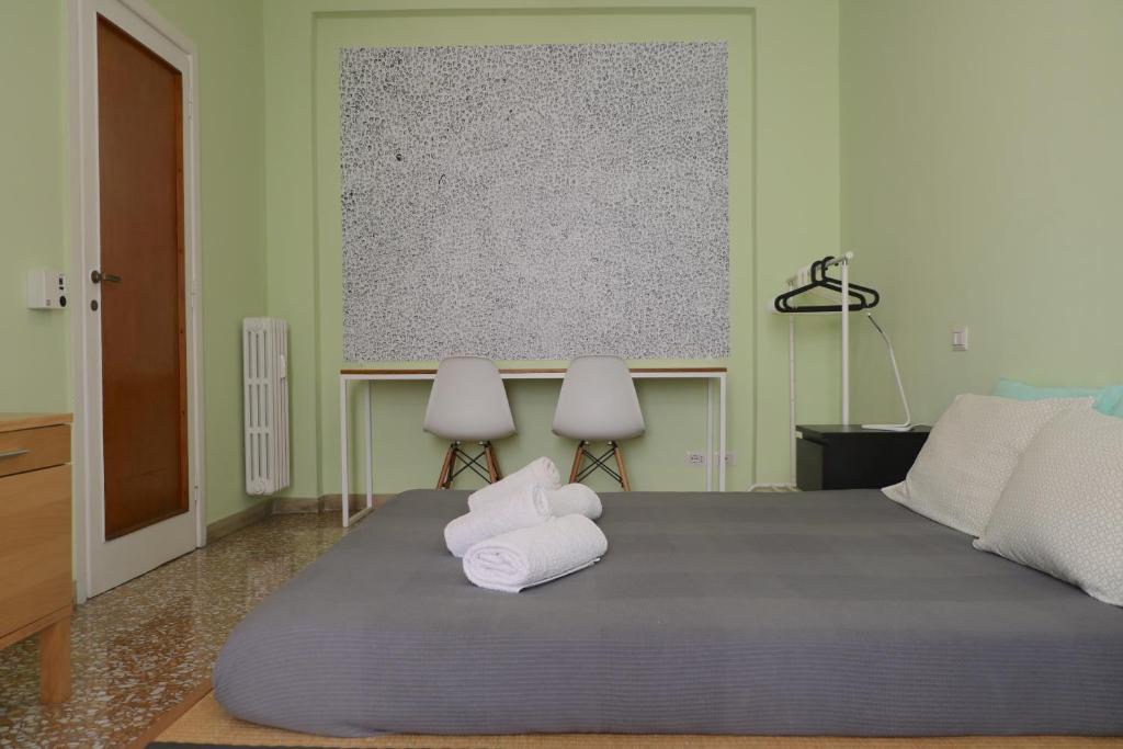 En eller flere senger på et rom på Rome Sleep Home Bed & Breakfast