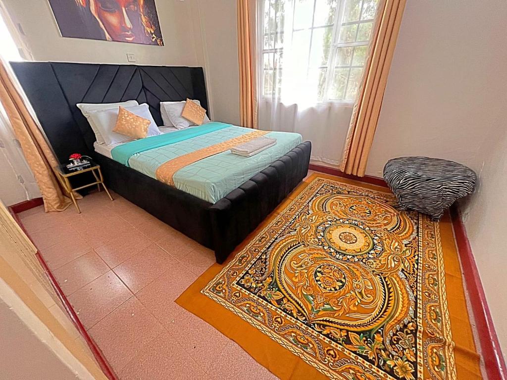 Postel nebo postele na pokoji v ubytování Homely apt 3 (three)