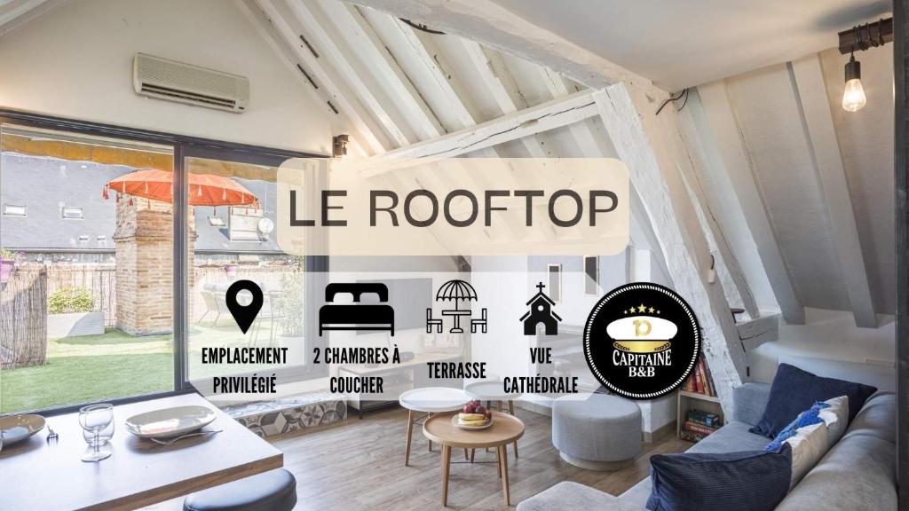 - un salon avec un panneau indiquant le toit dans l'établissement Le Rooftop - vue Cathédrale - Climatisation, à Troyes