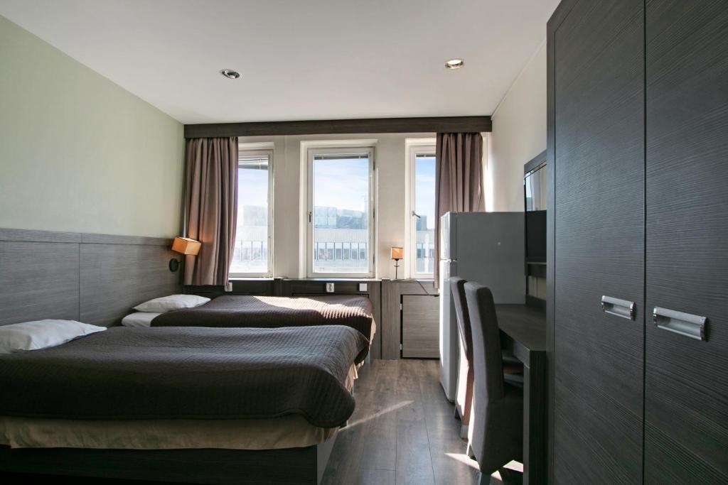 Postel nebo postele na pokoji v ubytování Brunnby Hotel