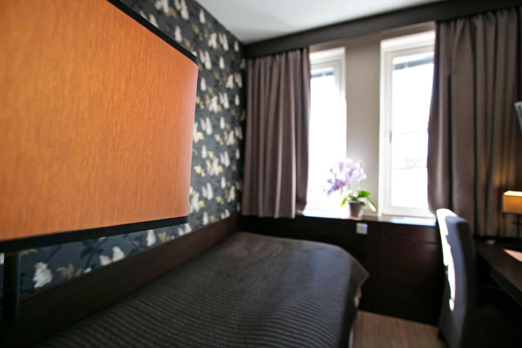 Postel nebo postele na pokoji v ubytování Brunnby Hotel