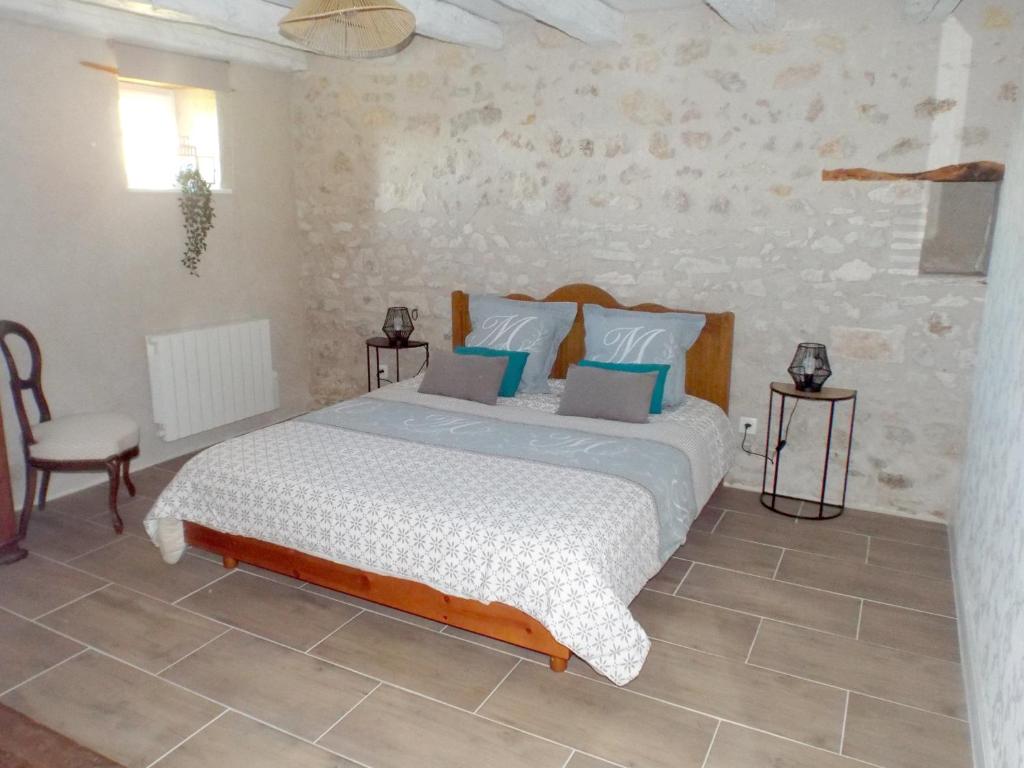 Ένα ή περισσότερα κρεβάτια σε δωμάτιο στο Gîte de la Grange