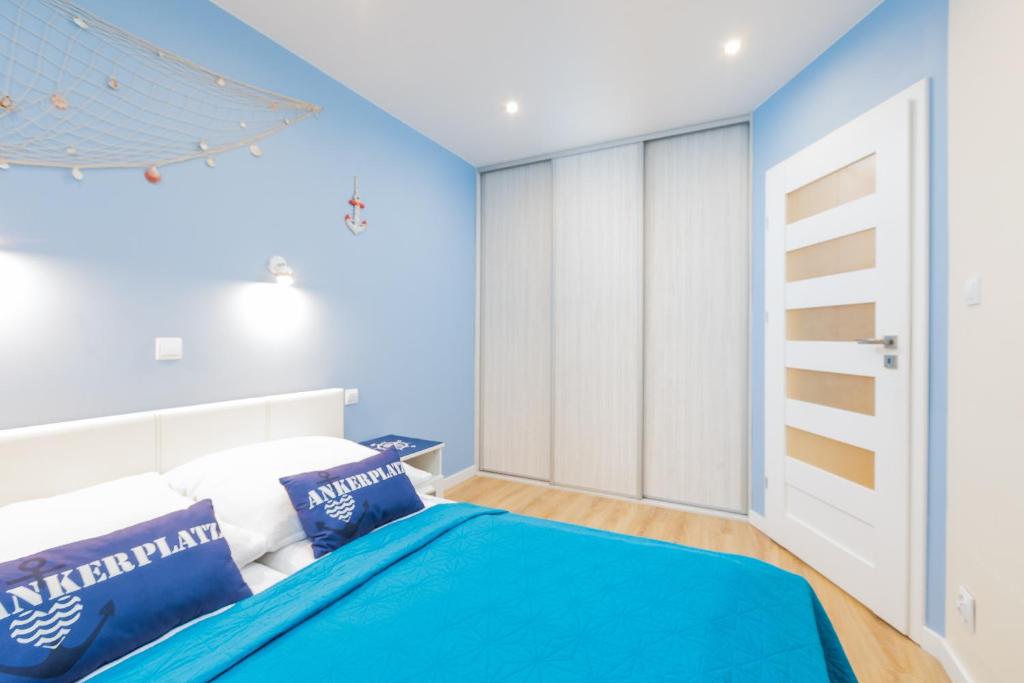 Postel nebo postele na pokoji v ubytování Apartament HAPPY 302 Łukęcin BlueMare basen EPapartamenty