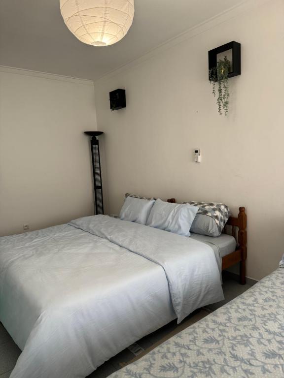 מיטה או מיטות בחדר ב-Torre suit property