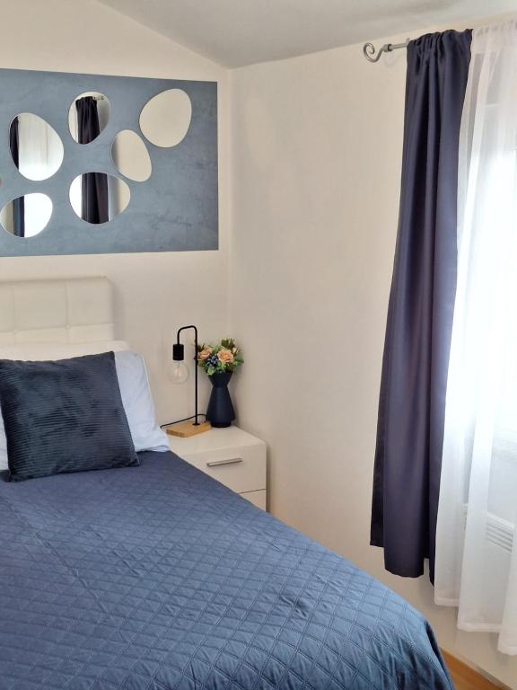 Posteľ alebo postele v izbe v ubytovaní Apartment Dorina