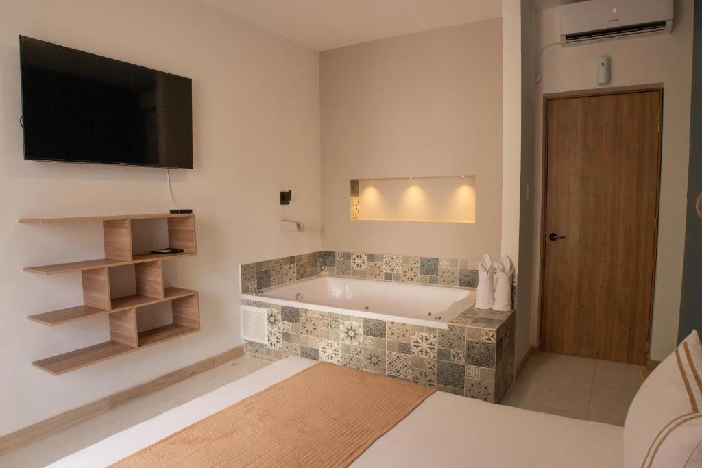 Postel nebo postele na pokoji v ubytování La Casona Hotel Boutique