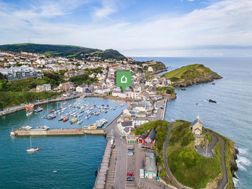 an aerial view of a harbor with boats in the water at 4 Bed in Ilfracombe 45121 in Ilfracombe