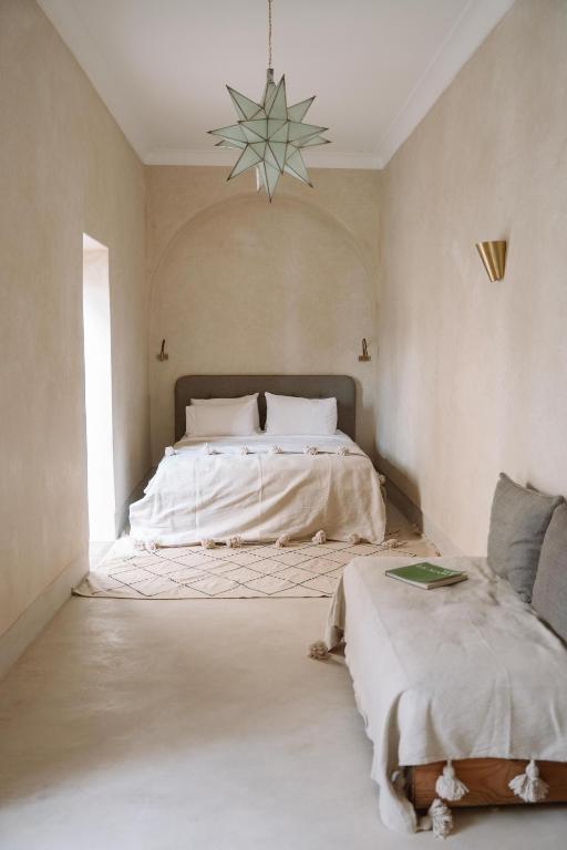 Postel nebo postele na pokoji v ubytování Riad Le Sable Vert