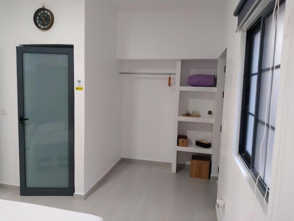 Postel nebo postele na pokoji v ubytování Palmira House
