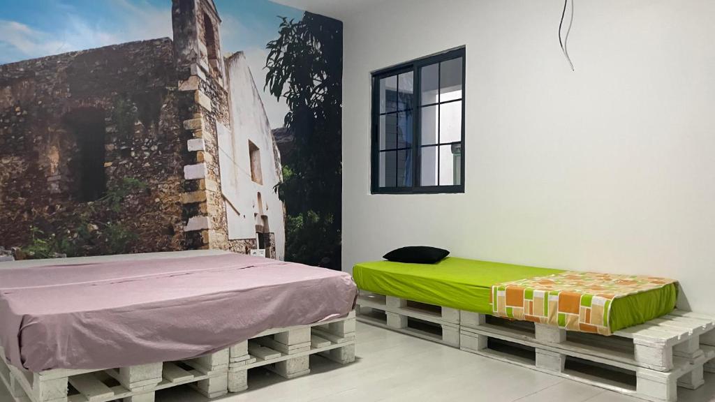 Postel nebo postele na pokoji v ubytování Palmira House