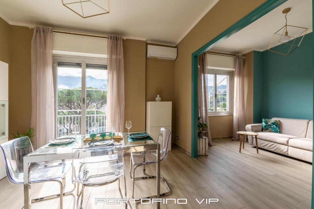 a living room with a table and chairs and a couch at Casa Gelsomini by PortofinoVip in Santa Margherita Ligure