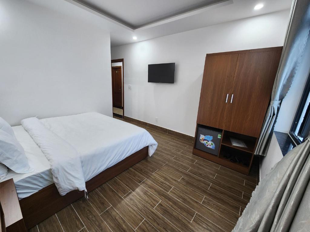 Postel nebo postele na pokoji v ubytování Happy Bun Hotel Da Lat