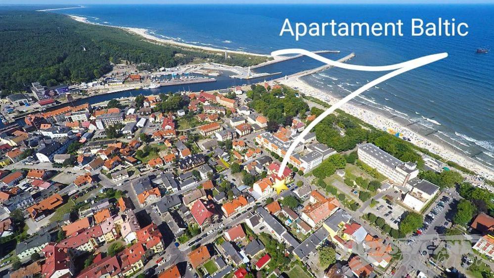 an aerial view of a town next to the ocean at Apartament Baltic Ustka in Ustka