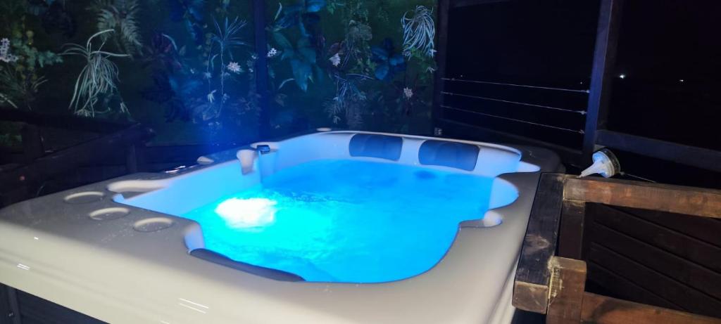 a bath tub with a blue liquid inside of it at Chalet Canario Panoramico in Maspalomas