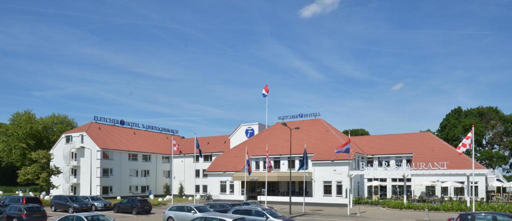 a large building with a kite flying in the air at Fletcher Hotel-Restaurant ‘s-Hertogenbosch in Den Bosch