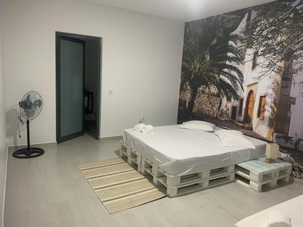 Postel nebo postele na pokoji v ubytování Palmira House